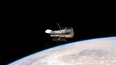 Telescopul Hubble a fotografiat ochiul unei galaxii din spațiul îndepărtat foto-02
